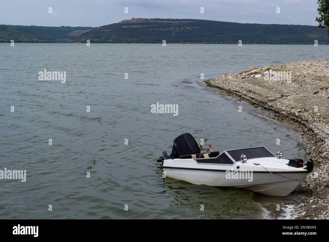 the boat stands on the bank of the river. Means of transportation on