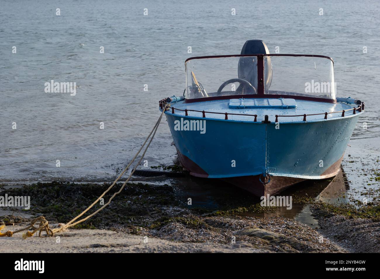 the boat stands on the bank of the river. Means of transportation on