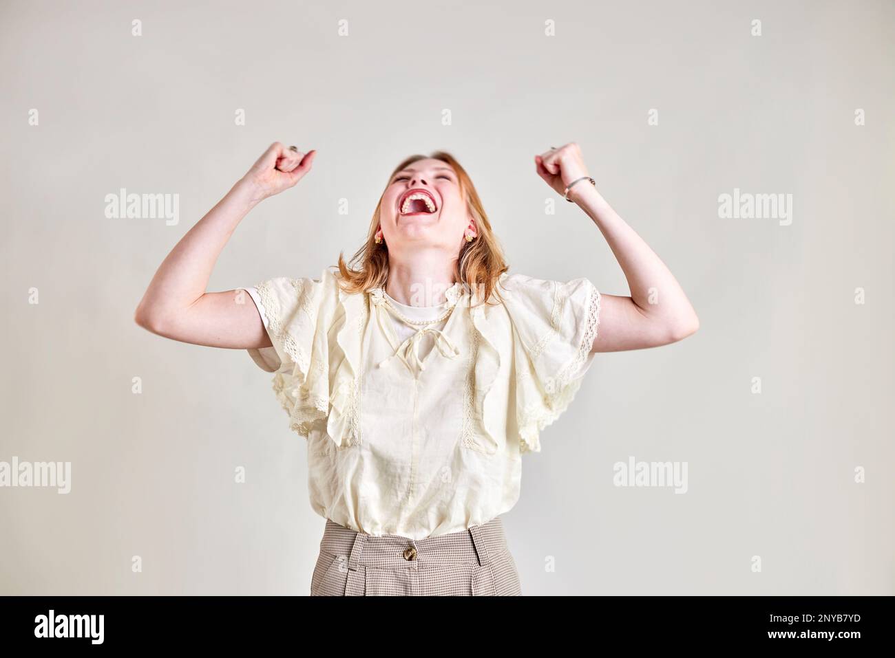 Young woman with red hair very happy and smiling Stock Photo - Alamy