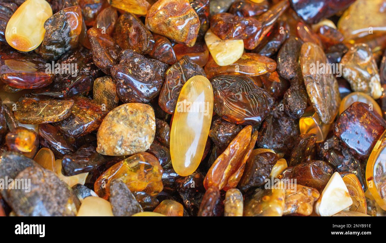 A pile of polished Baltic amber. Natural decorative material used in