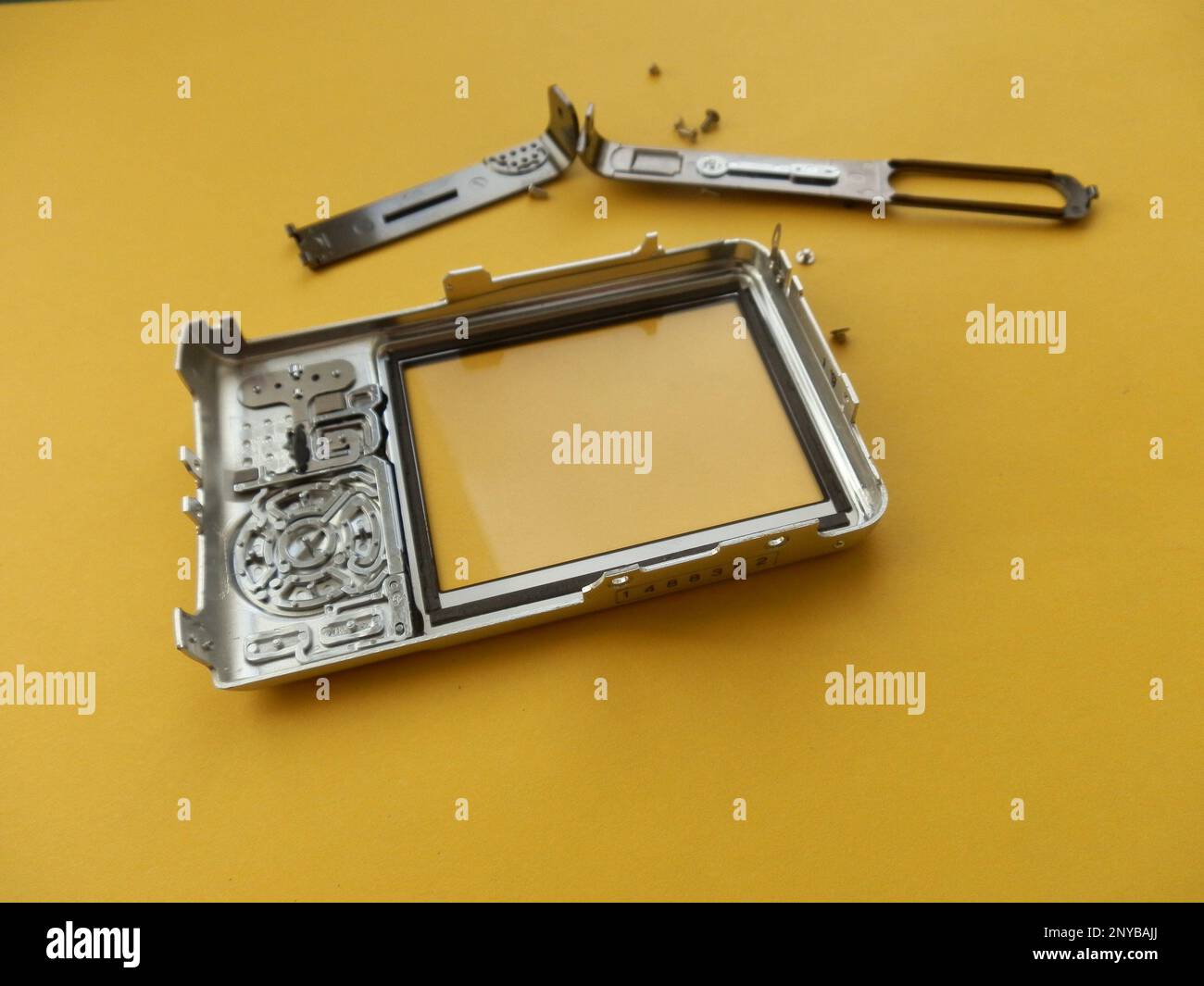 Repair and disassembly of a the pocket digital camera. Stock Photo