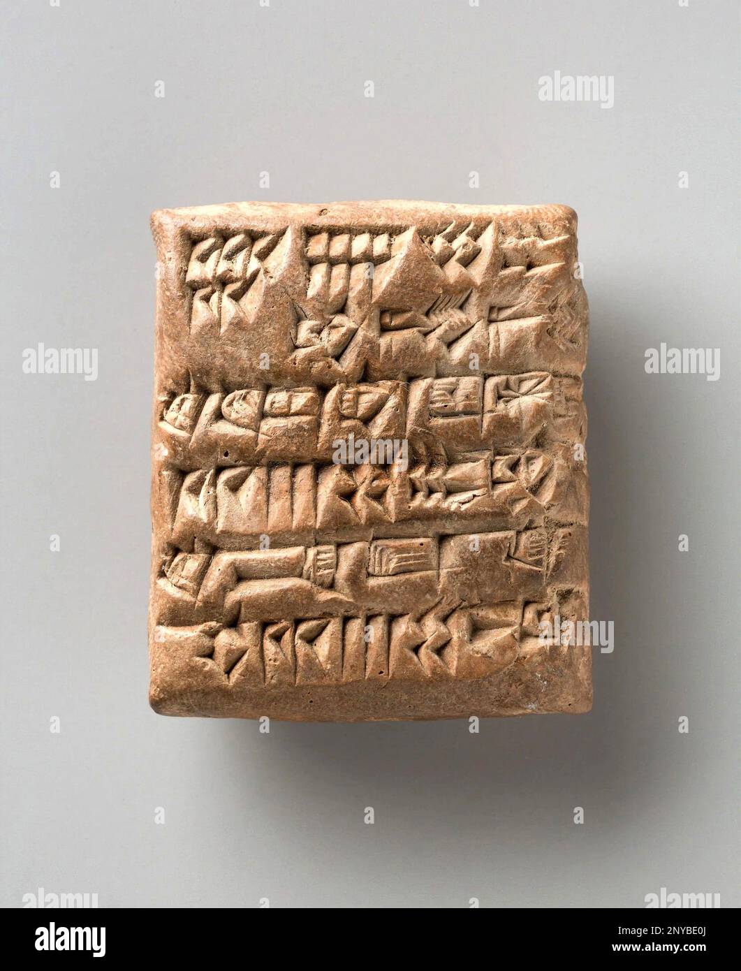 Cuneiform Tablet Recording Delivery of Reeds, 2028 BCE.Sumerian, Mesopotamian. Clay. Overall: 2 × 1 11/16 × 3/4 inches (5.1 × 4.3 × 1.9 cm). ''Twelve Stock Photo