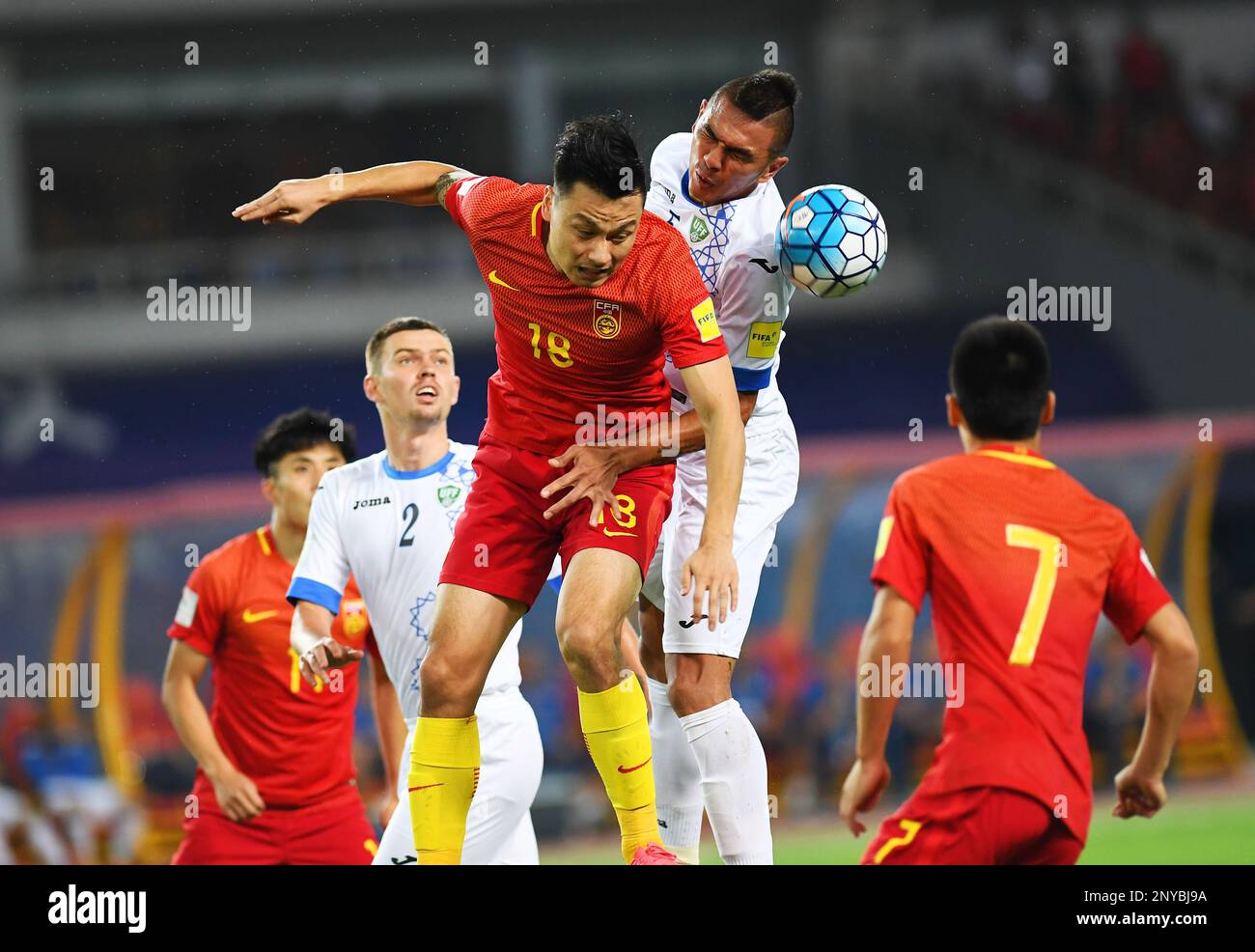 Gao Lin of China, left, heads the ball against a player of Uzbekistan in  their Group A Round 9 match against Uzbekistan during the 2018 FIFA World  Cup Russia Qualifier in Wuhan