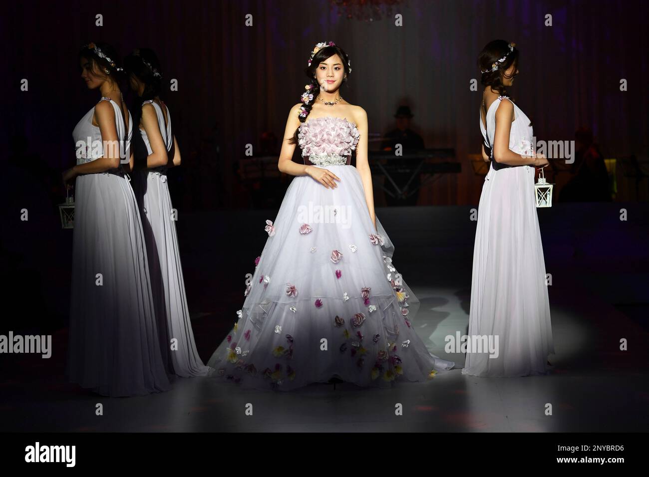 A model presents a wedding dress inspired by Disney Character