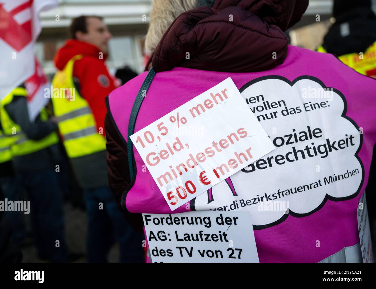 Munich, Germany. 02nd Mar, 2023. A note with the inscription '10.5% more money, at least ·500 more' is seen on the vest of a woman during the rally of employees of the Munich Transport Company (MVG), the Munich Waste Management Company (AWM) and the Munich Municipal Works (SWM). In Munich, large parts of the public transport system are at a standstill on Thursday and Friday. Verdi strikes subways and streetcars, about half of the buses will also not run. Credit: Sven Hoppe/dpa/Alamy Live News Stock Photo
