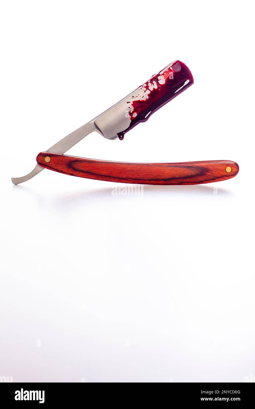 traditional bloody razor on white background Stock Photo