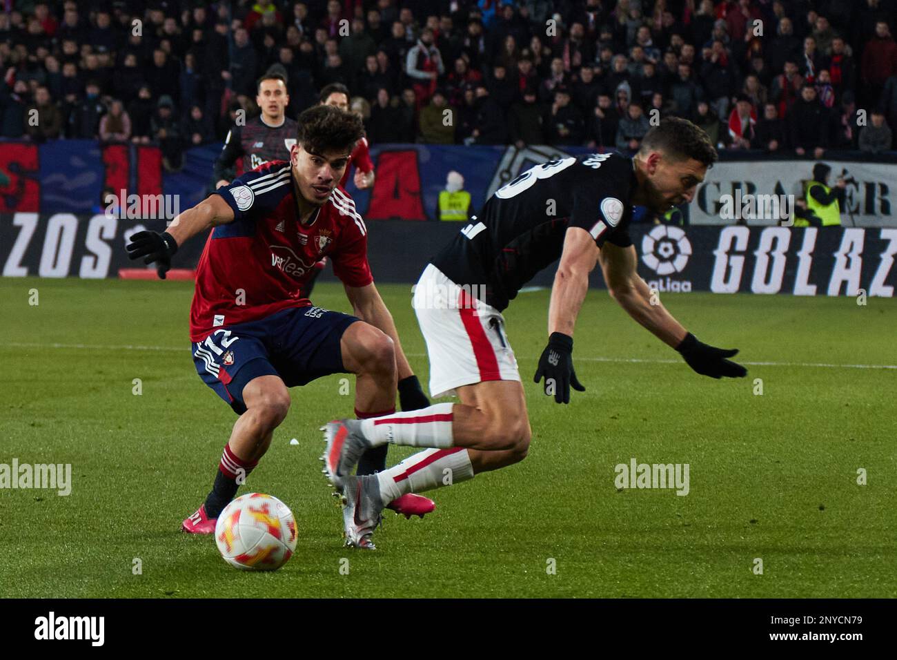 Pamplona, Spain. 1st Mar. 2023. Sports. Football/Soccer. Abde (12. CA Osasuna) and De Marcos (18. Athletic Club) during the first leg football match of the semifinal of the Copa del Rey between CA Osasuna and Athletic Club played at El Sadar stadium in Pamplona (Spain) on March 1, 2023. Credit: Iñigo Alzugaray/Alamy Live News Stock Photo