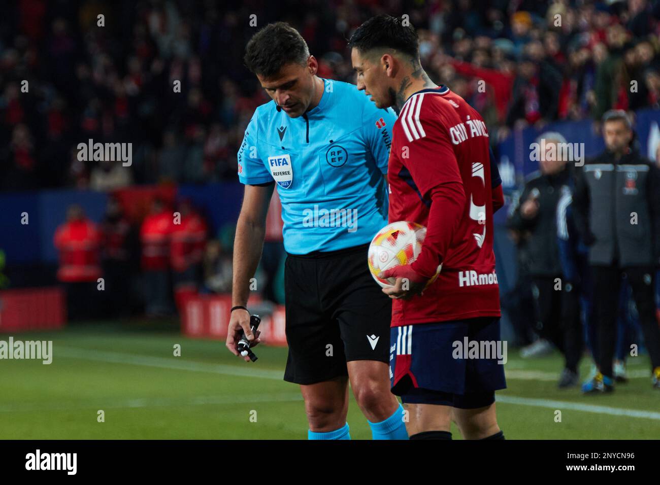 Pamplona, Spain. 1st Mar. 2023. Sports. Football/Soccer. Jesus Gil Manzano (match referee) and Chimy Avila (9. CA Osasuna) during the first leg football match of the semifinal of the Copa del Rey between CA Osasuna and Athletic Club played at El Sadar stadium in Pamplona (Spain) on March 1, 2023. Credit: Iñigo Alzugaray/Alamy Live News Stock Photo