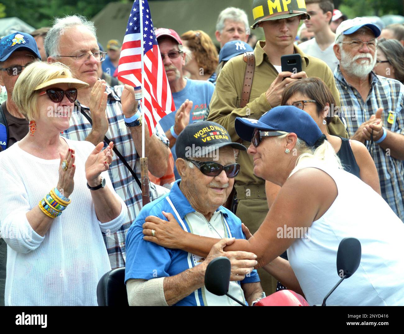 Barb Smith, right, of Oberlin gives World War II Veteran John Ruzum of