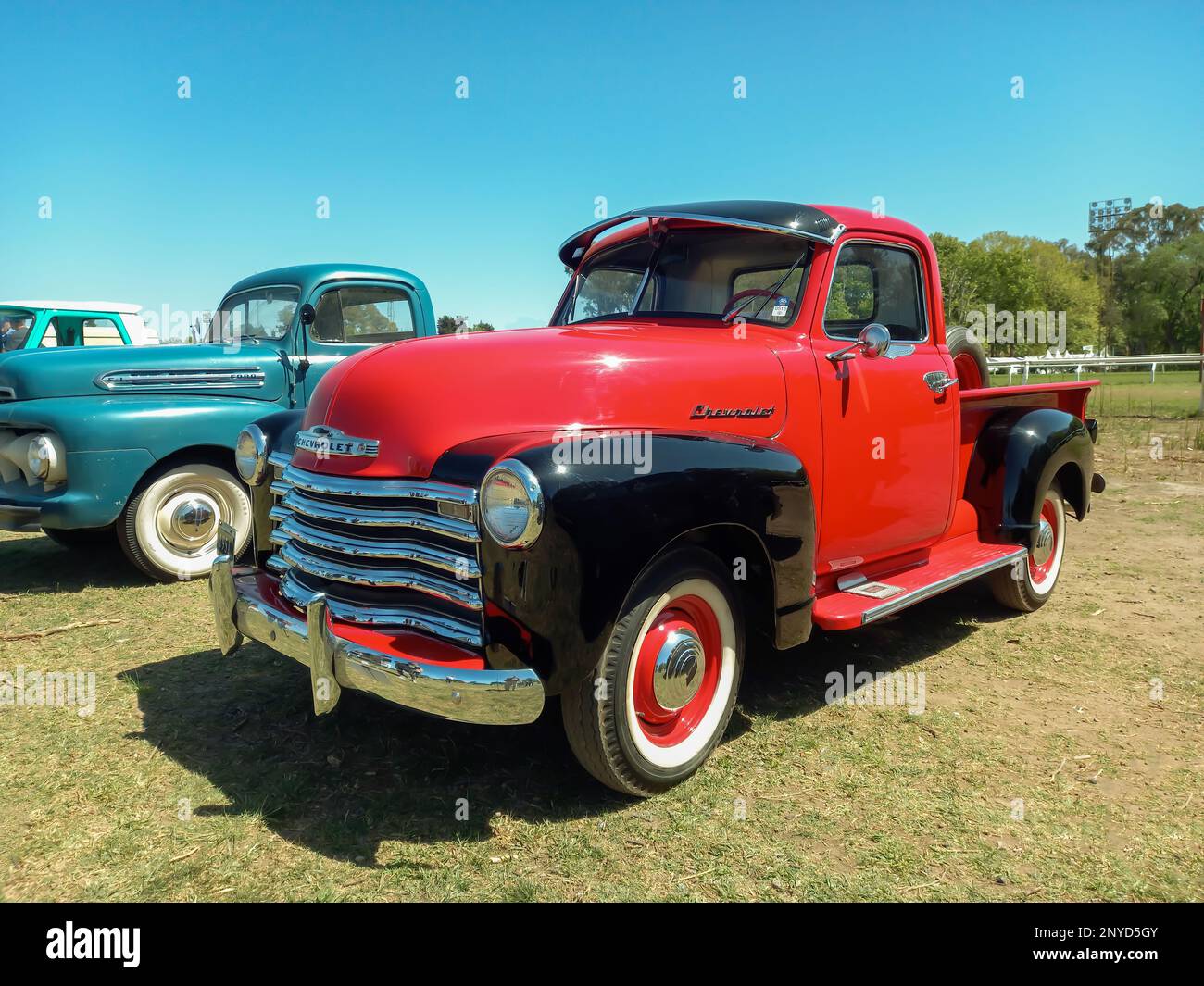 Old red and black 1951 Chevrolet Chevy 3100 pickup truck Advance Design by GM.  Sunny day in the countryside. Autoclasica 2022 classic car show. Stock Photo
