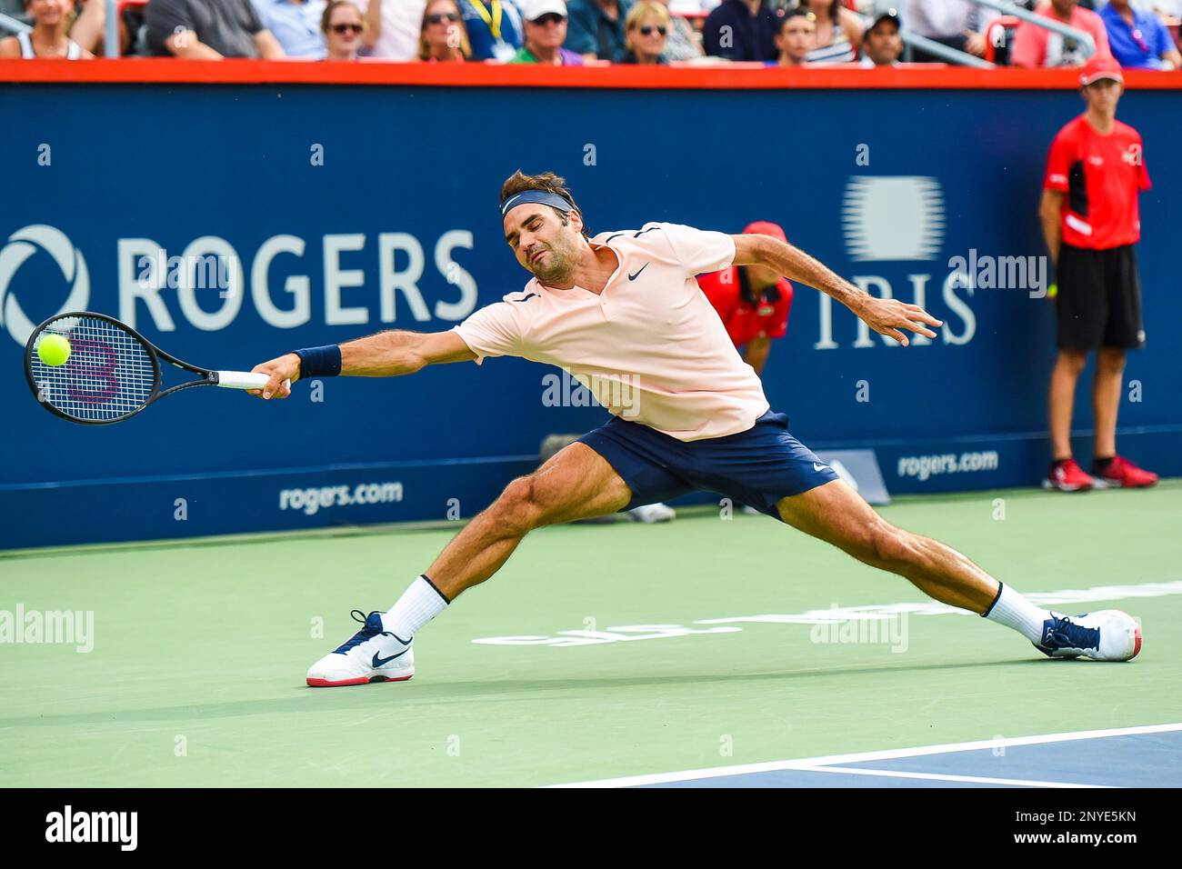 MONTREAL, QC - AUGUST 10: Roger Federer (SUI) stretches out then returns  the ball during his third round match at ATP Coupe Rogers on August 10,  2017, at Uniprix Stadium in Montreal,