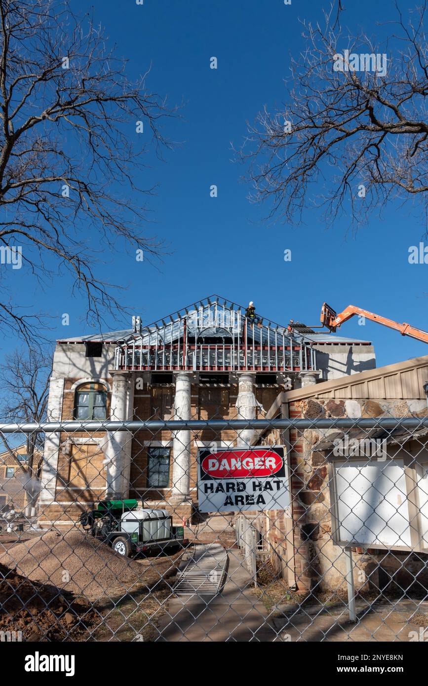 Mason County Courthouse under construction after fire destroyed most of original historic building. Sign reads Danger Hard Hat Area. Mason, Texas, USA Stock Photo