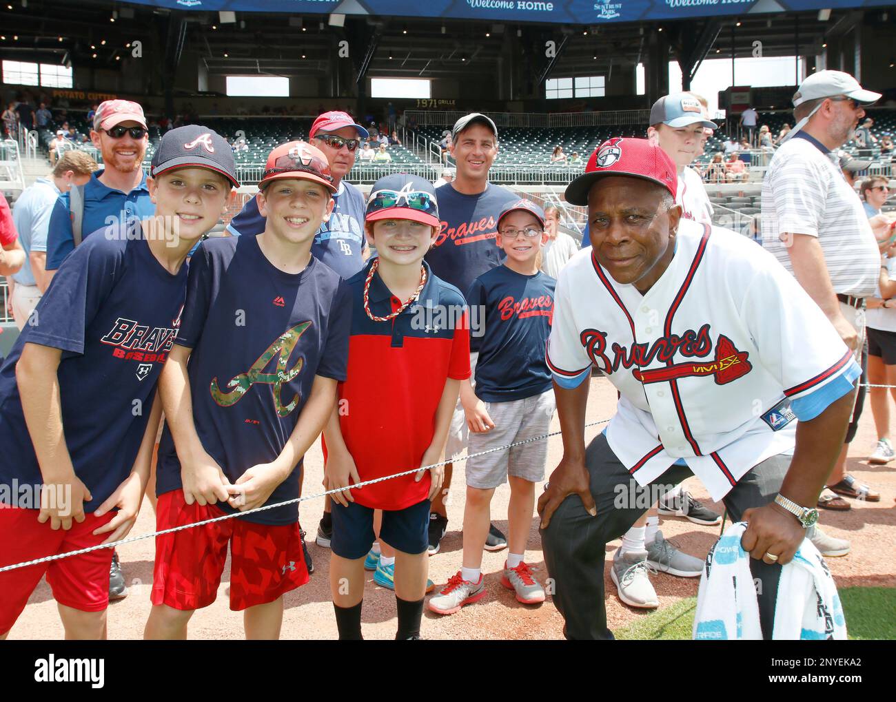 ATLANTA, GA - AUGUST 06: Former Braves player, Ralph Garr (r) takes a photo  with some young fans prior to the MLB game between the Atlanta Braves and  the Miami Marlins on