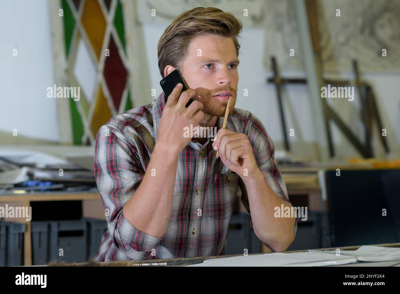 man on the phone thinking Stock Photo