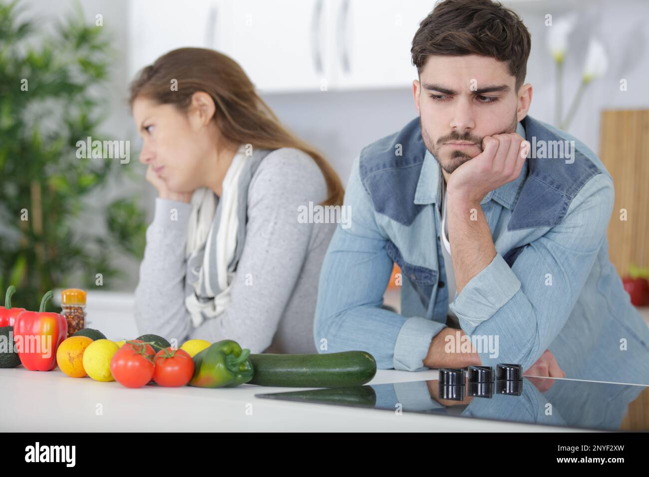 couple having an argument in the kitchen Stock Photo