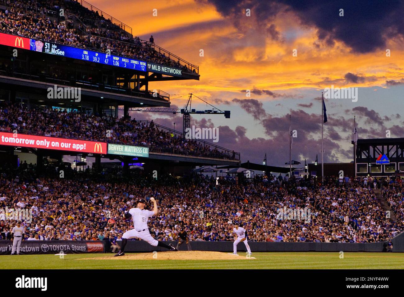 The game between the Colorado Rockies and the Pittsburg Pirates continues  beneath a golden sunset, July 22, 2017 in Denver. (Margaret Bowles via AP  Images Stock Photo - Alamy