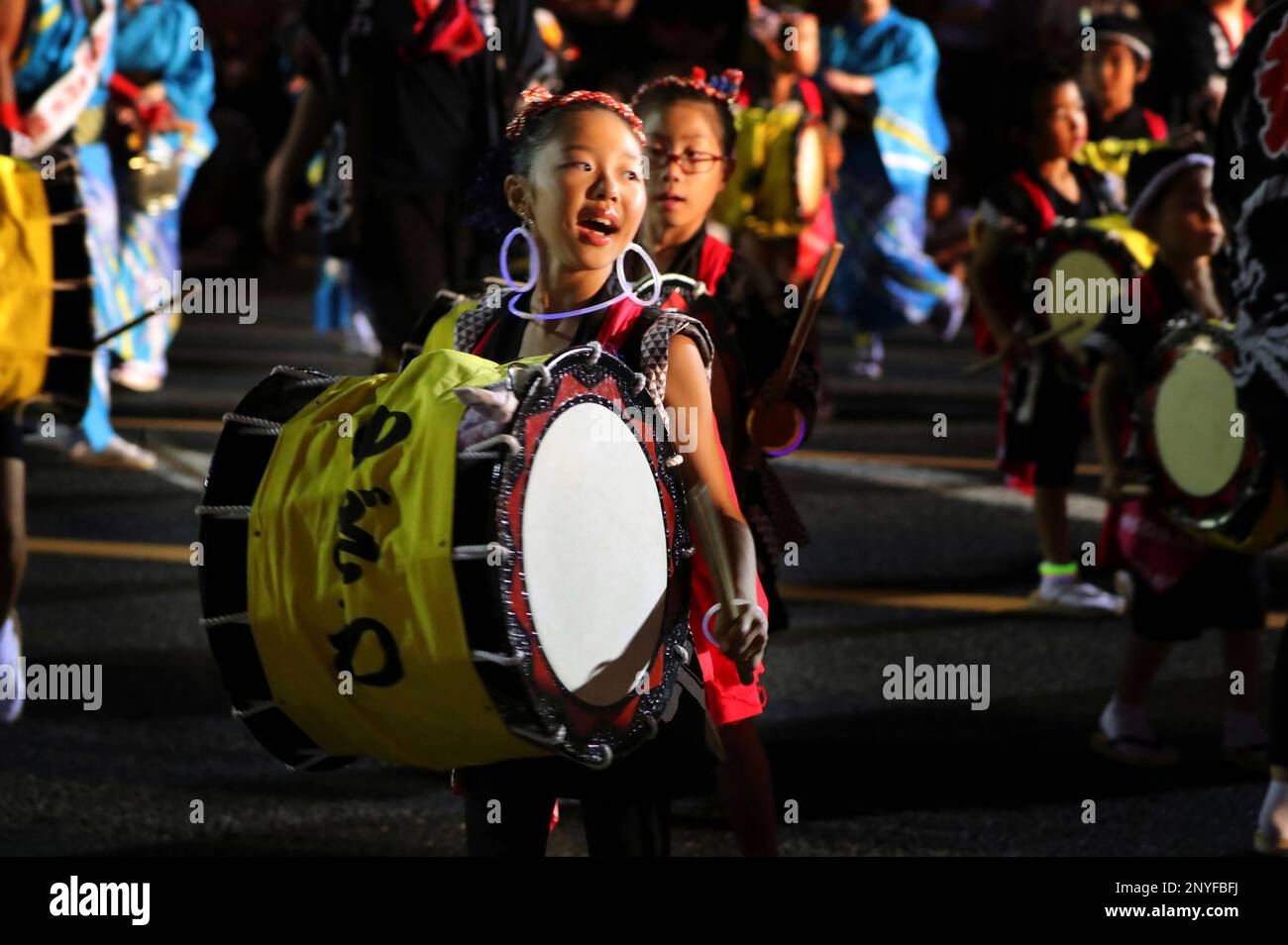 Girls drumming taiko parade through the street during the Morioka Sansa  Dance festival in Morioka, Iwate Prefecture on August 1, 2017. Sansa, one  of the five Tohoku major fesitival, is listed in