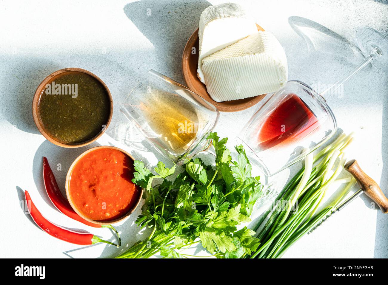 Traditional Georgian food concept with spices, sauces and wines on concrete table Stock Photo