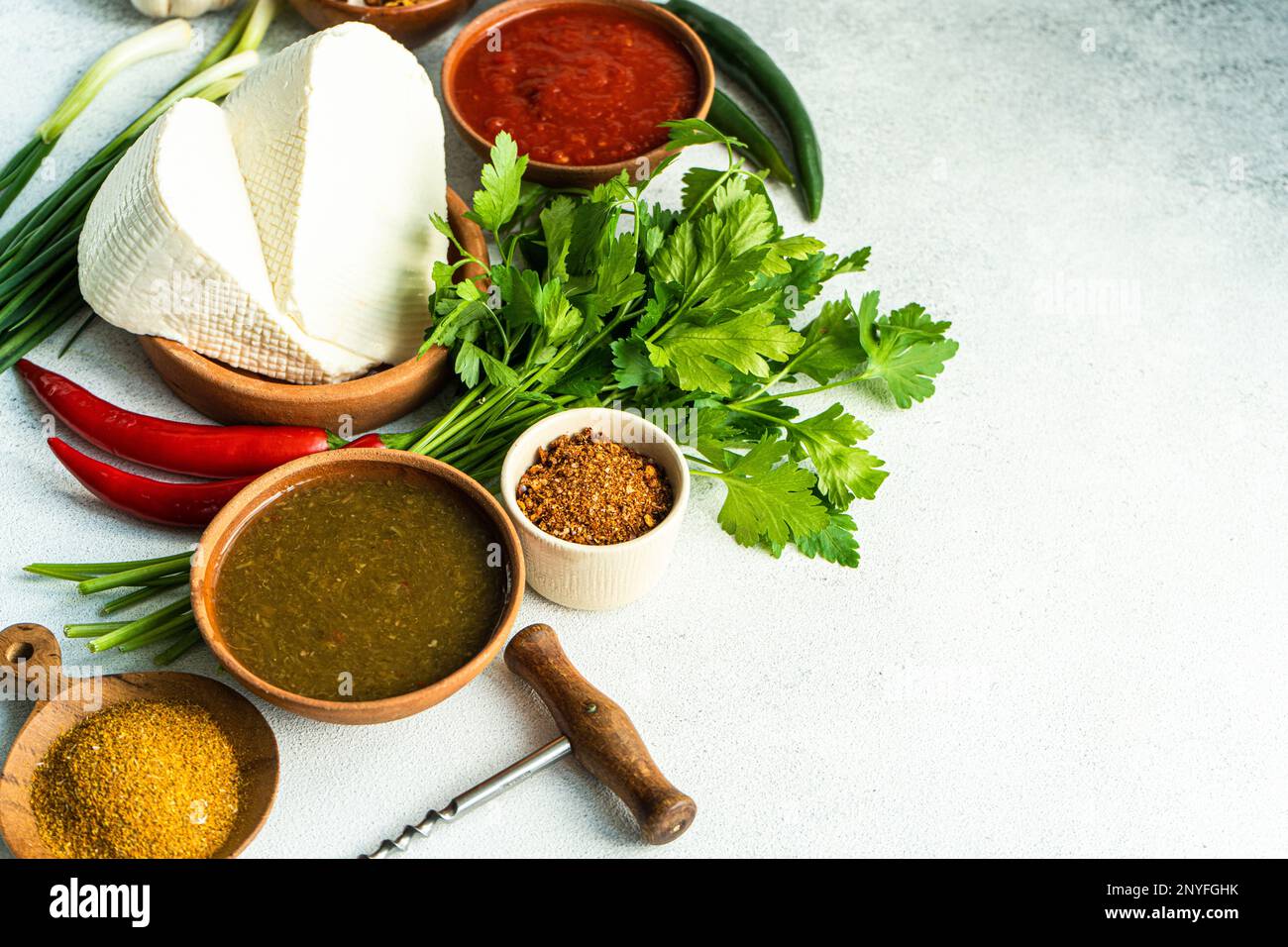 Traditional Georgian food concept with spices, sauces on concrete table Stock Photo