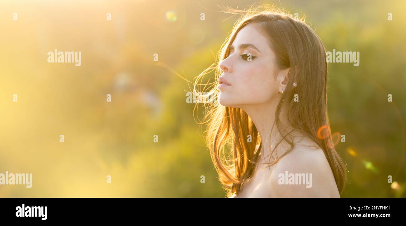 Spring woman on sunlight romantic portrait, sensual sunny face. Banner