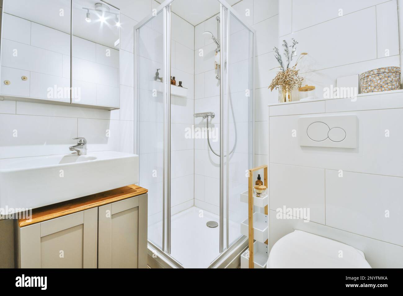 Bright interior of modern clean bathroom with glass shower cabin and ...