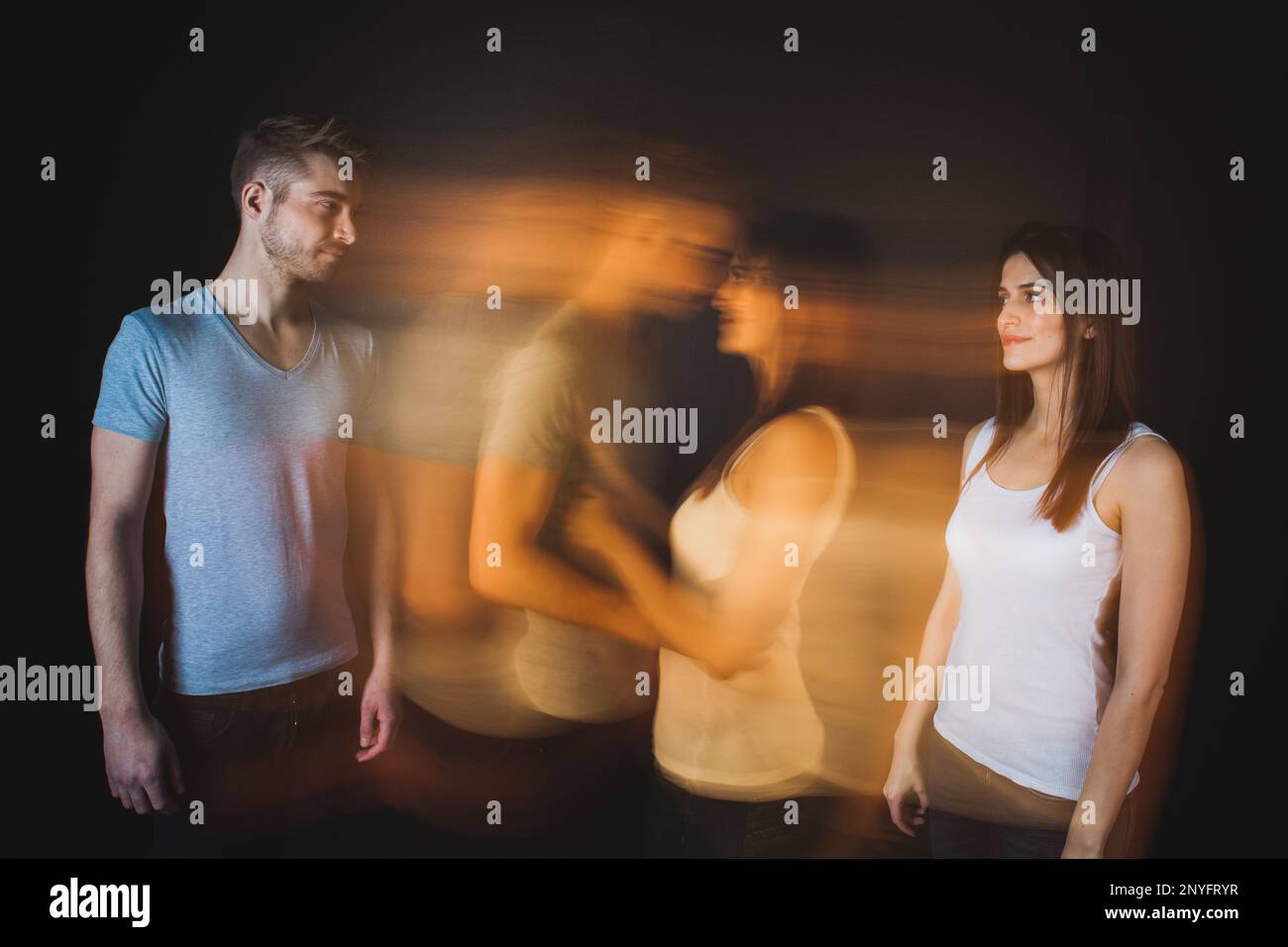 Couple embracing posing in studio Stock Photo