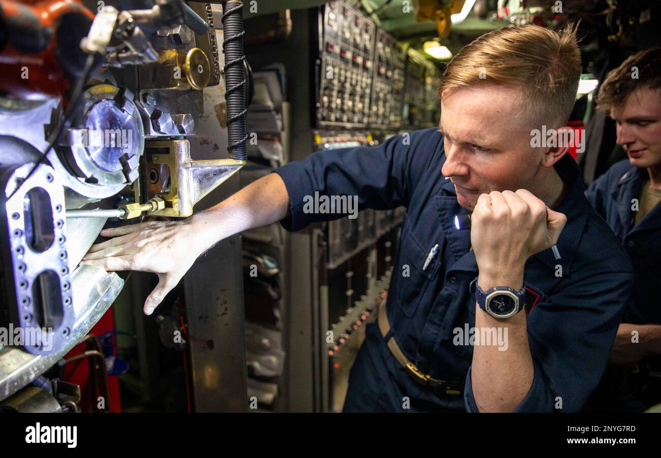 PHILIPPINE SEA (Jan. 23, 2023) – Lt. j.g. Doug Burkhart, assigned to the Los Angeles-class fast-attack submarine USS Annapolis (SSN 760), inspects a torpedo tube in the torpedo room, Jan. 23. Annapolis is conducting maritime operations in the U.S. 7th Fleet area of operations to maintain a safe and open Indo-Pacific. Stock Photo