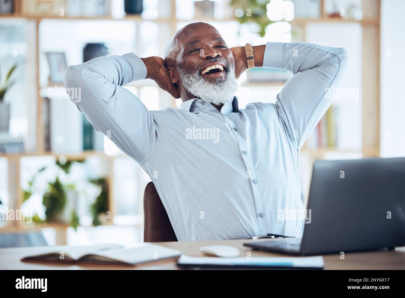 Happy black man stretching at desk for relax, online success and work ...