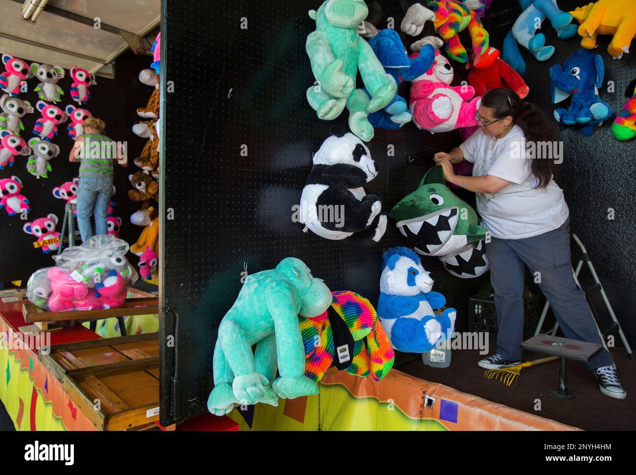 fair-worker-jasmine-degrado-decorates-her-booth-with-stuffed-animal