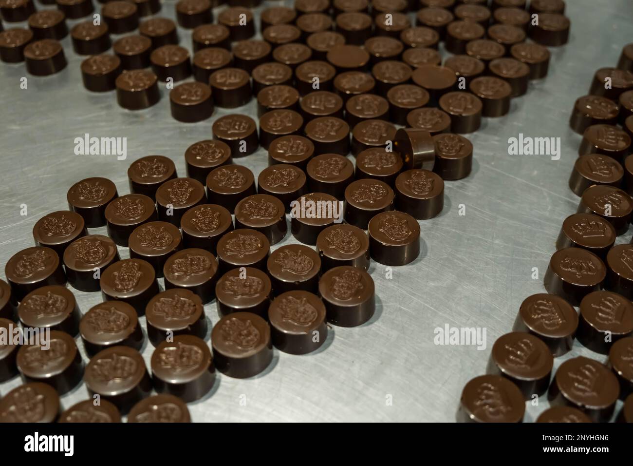 Chocolate candy making. Sweets production and industry concept Stock