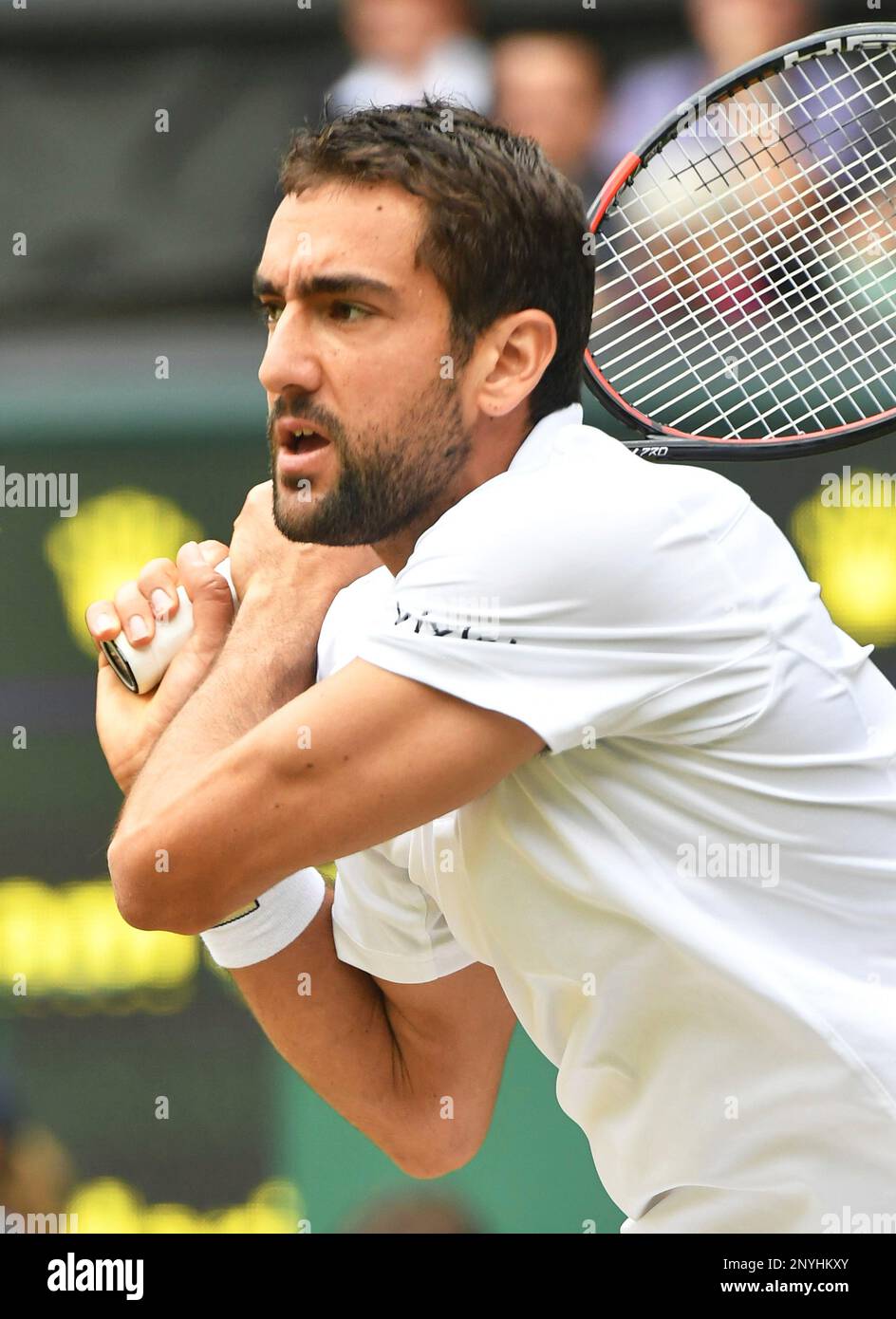 Marine Cilic of Croatia hits during the Gentlemen' singles semi-finals of  the Wimbledon tennis tournament against Sam Querrey of U.S. at All England Tennis  Club in London on July 14, 2017.( The
