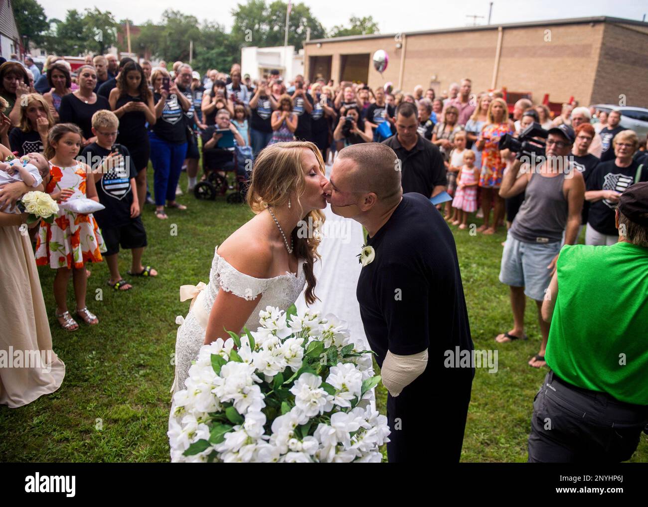 Leechburg Police Chief Mike Diebold kisses his wife Danielle Reinke