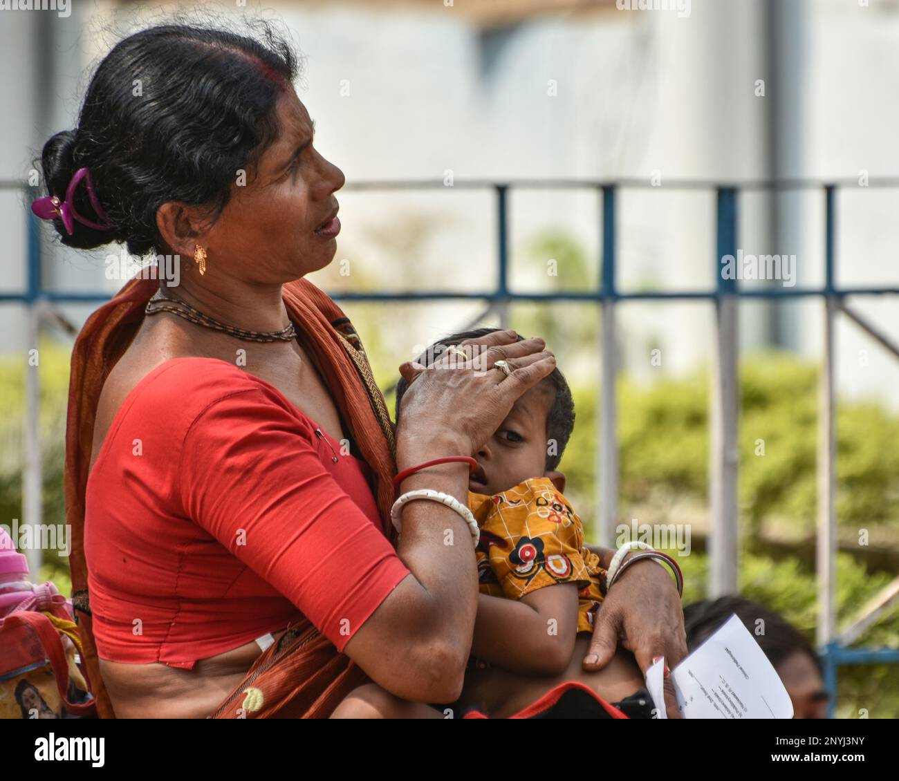 A Woman Carries Her Child Suffering From Acute Respiratory Infection ...