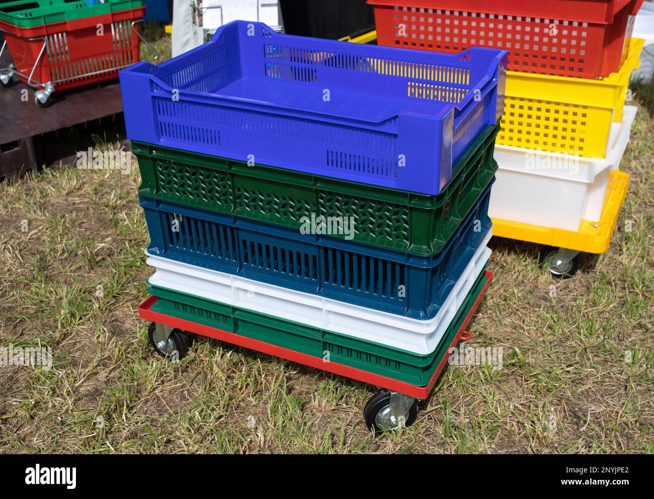 A lot of plastic packaging lies on a wooden floor. Plastic bottles of