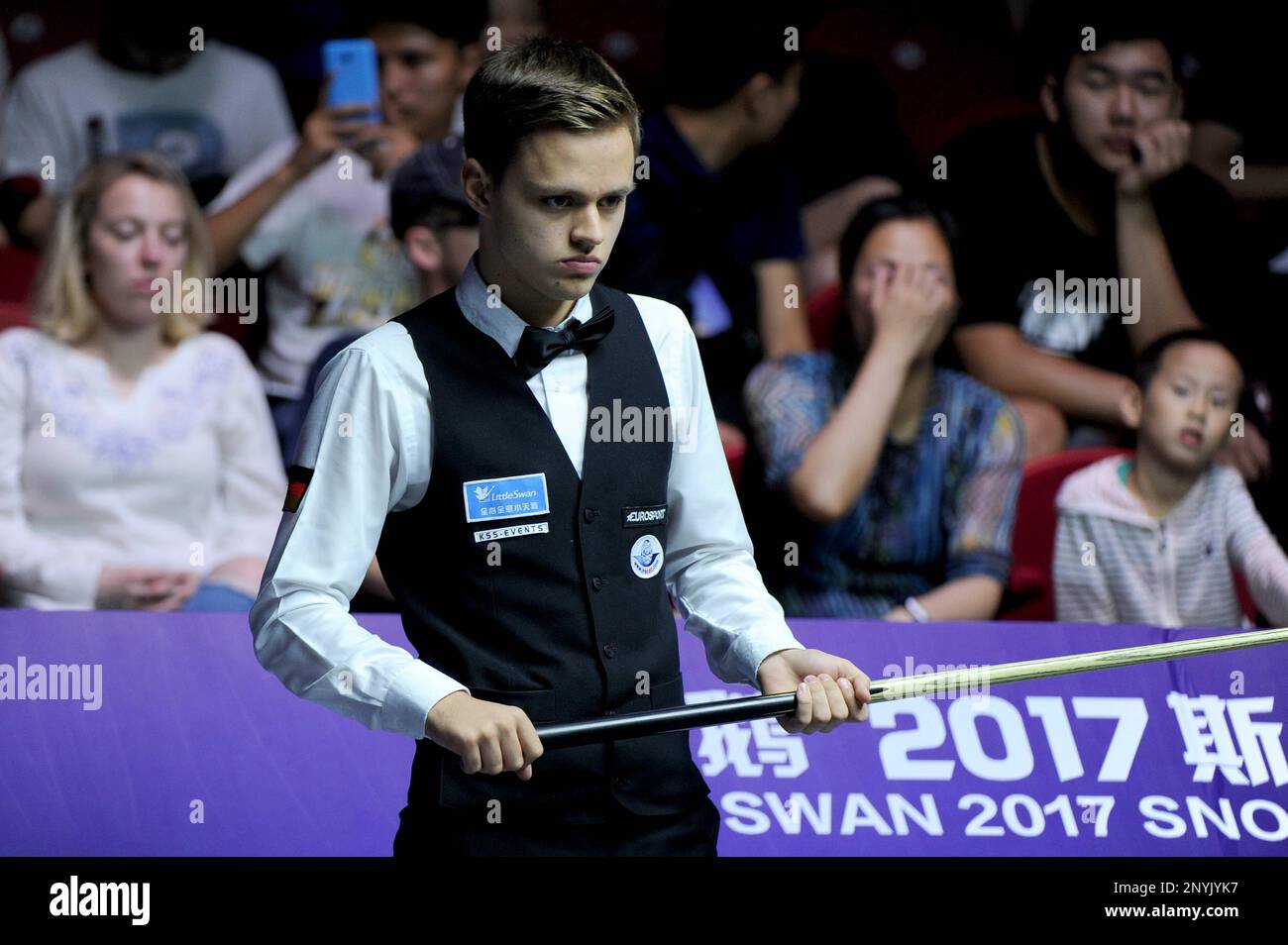 Lukas Kleckers of Germany considers a shot to China A in a Group B match during the 2017 Snooker World Cup Tournament in Wuxi city, east Chinas Jiangsu province, 4 July 2017.China