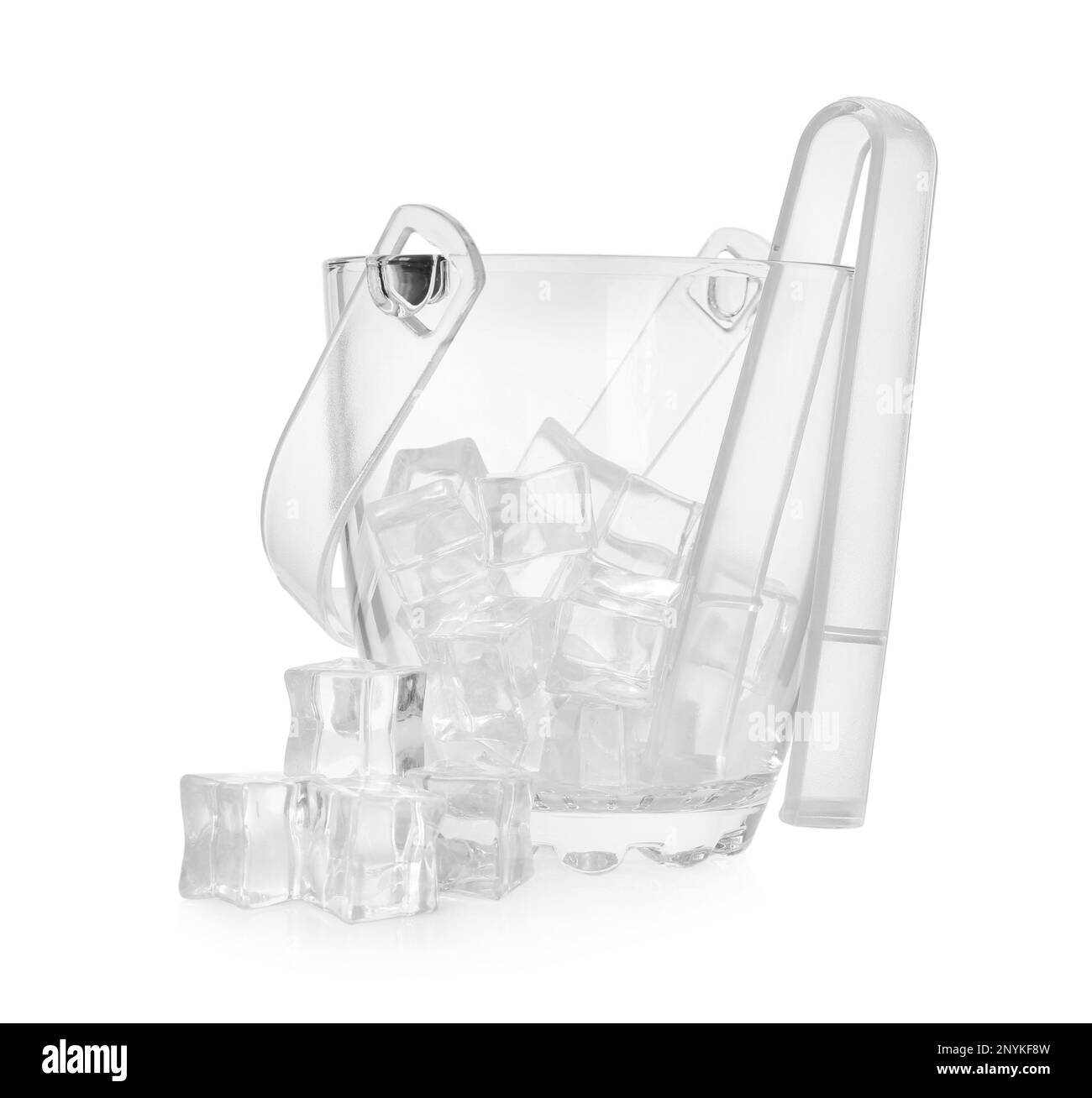 Glass bucket with ice cubes and tongs on white background Stock Photo