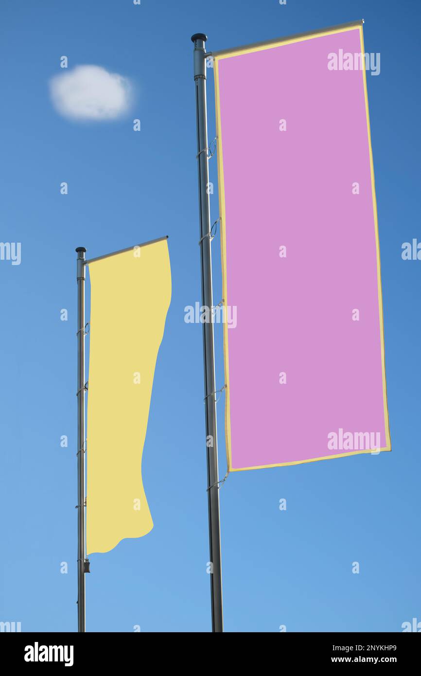 2 empty blank flags, blank beach flags, free pink and yellow copy space Stock Photo