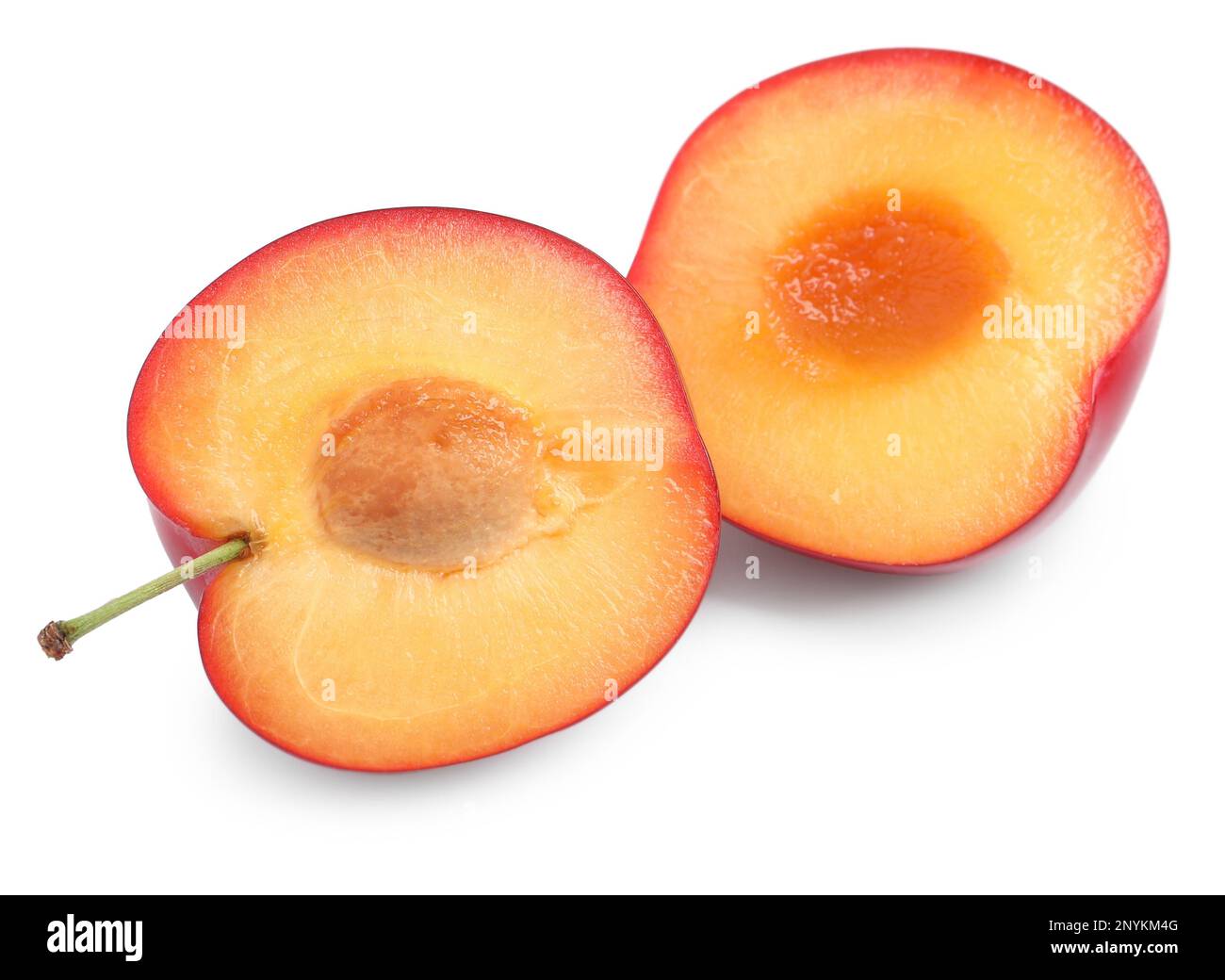 Cut ripe cherry plum on white background Stock Photo - Alamy