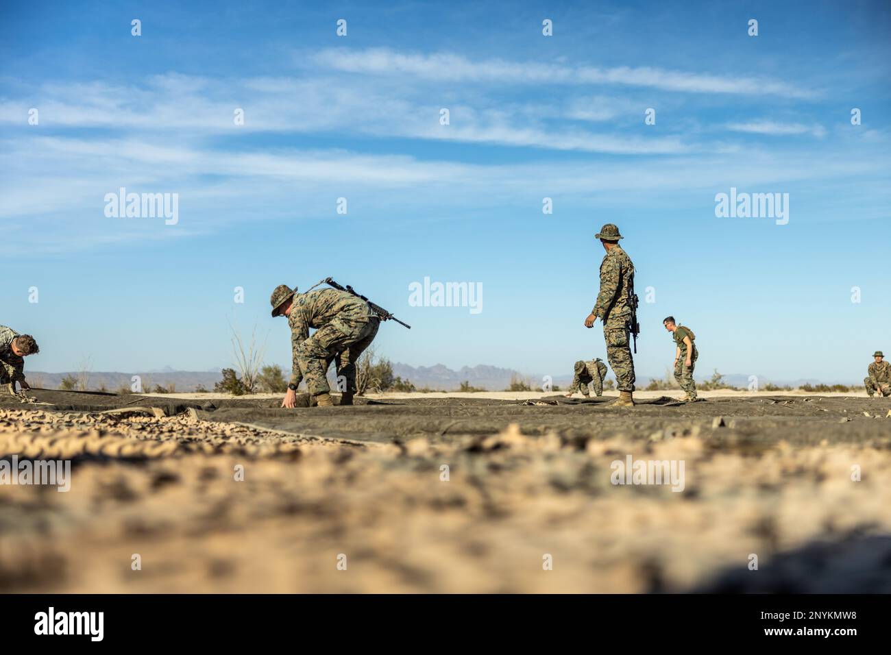 U.S. Marines with 3d Littoral Anti-Air Battalion, 3d Marine Littoral Regiment, 3d Marine Division, prepare to displace during Marine Littoral Regiment Training Exercise (MLR-TE) at Marine Corps Air Station Yuma, Arizona, Feb. 10, 2023. MLR-TE is a large-scale, service-level exercise designed to train, develop, and experiment with the 3d MLR as part of a Marine Air-Ground Task Force operating as a Stand-in Force across a contested and distributed maritime environment. Stock Photo