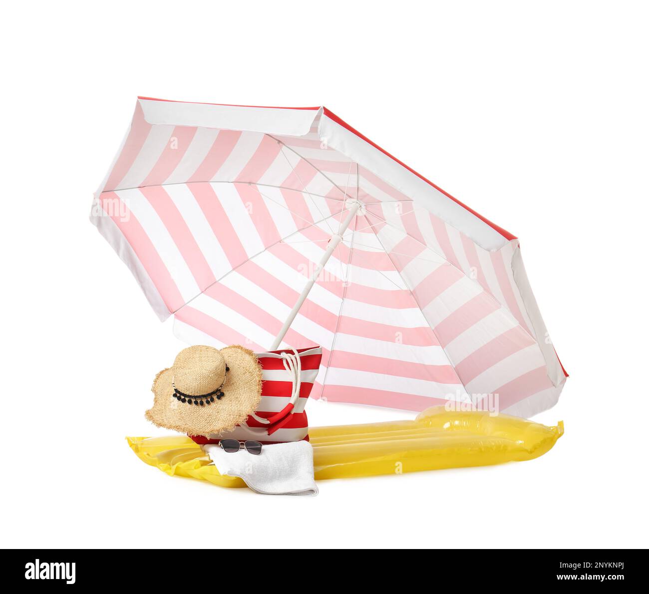 Open striped beach umbrella, inflatable mattress, bag and accessories on white background Stock Photo