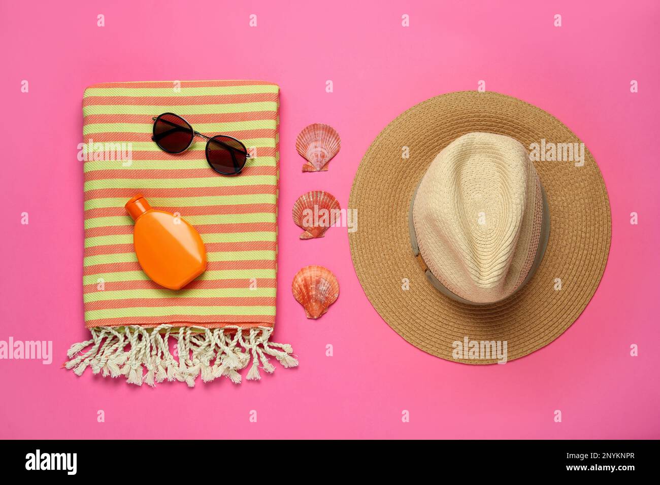 Flat lay composition with different beach objects on pink background Stock Photo