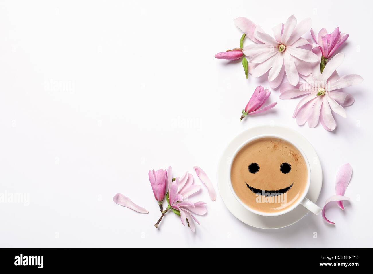 Good morning! Beautiful pink magnolia flowers and cup of aromatic