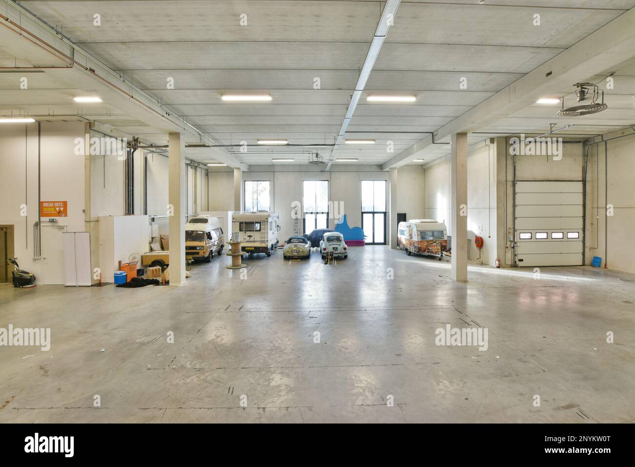 the inside of a building with lots of work on the floor and walls in ...