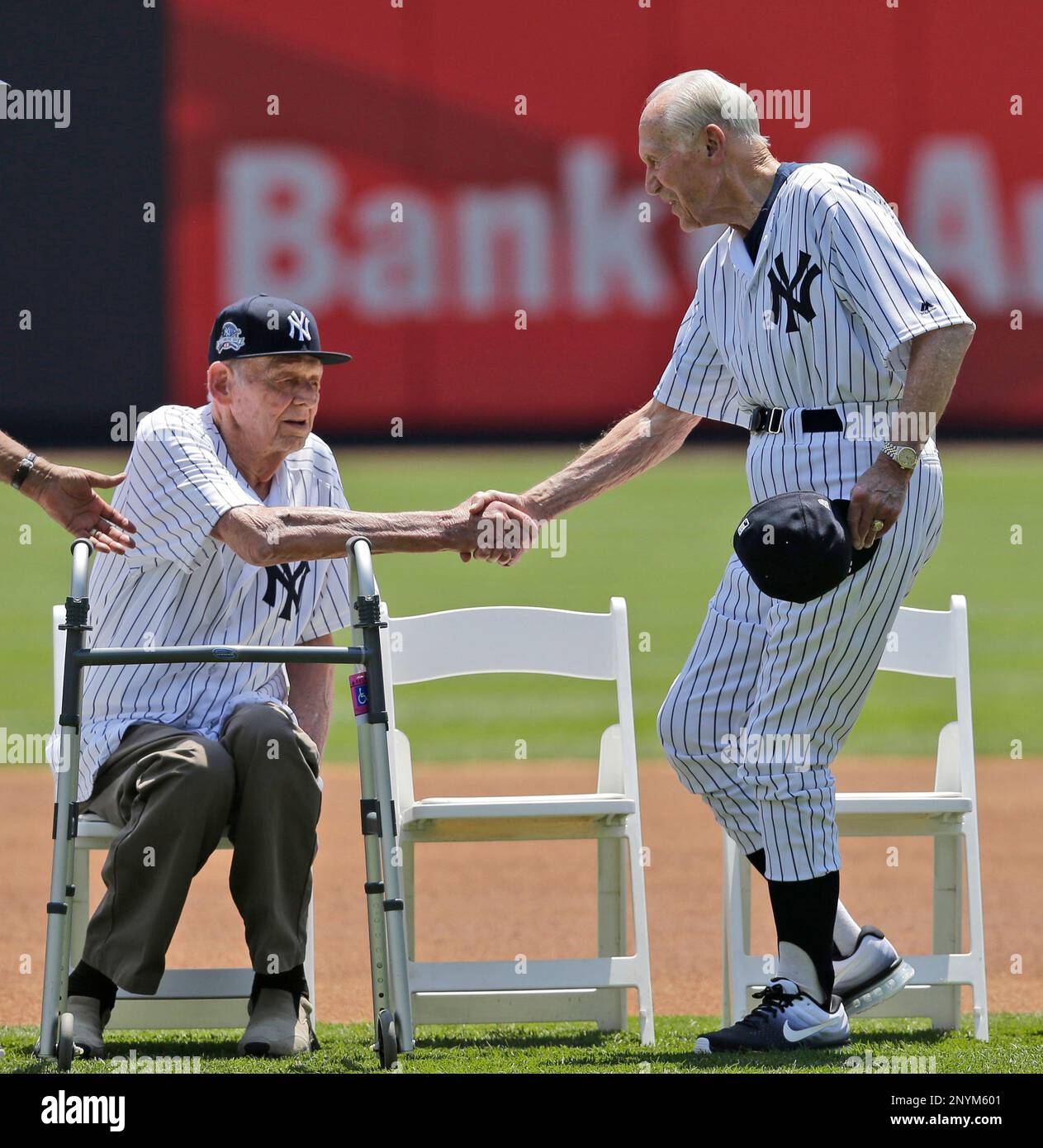Former New York Yankees Bobby Brown, right, shakes hands with Don