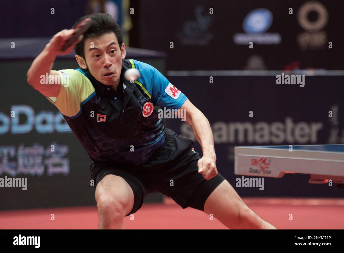 Wong Chun Ting of Hong Kong returns a shot to Dimitrij Ovtcharov of Germany in their semifinal match of the mens singles during the Seamaster 2017 ITTF World Tour Platinum China Open