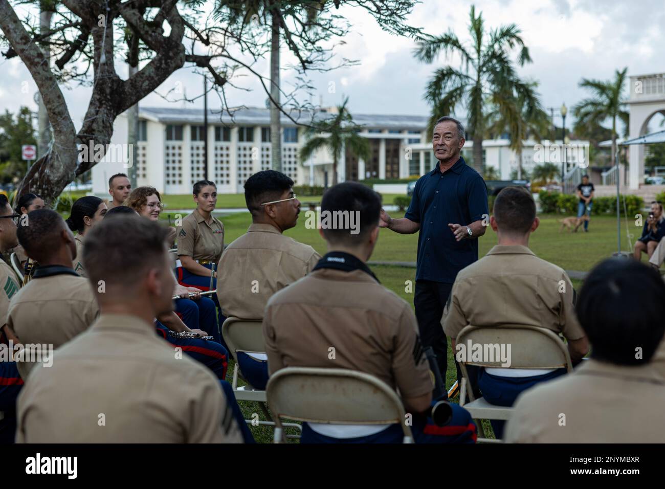 U.S. Congressman James Moylan, who will serve on the House Armed Forces and natural resources committee of Guam, speaks to U.S. Marines with Marine Corps Forces Pacific Band before a musical performance at Plaza de Espana, Hagatna, Guam, Jan. 23, 2023.  The MARFORPAC Band participated in multiple community engagements during their visit to Guam as part of the Naval Support Activity, Marine Corps Base Camp Blaz Reactivation and Naming Ceremony. In order to encourage music education and showcase the vibrant history and tradition of military music, the band is active in providing clinics and conc Stock Photo
