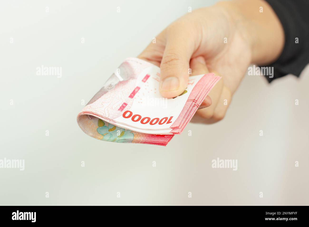 Cash payment concept Indonesian rupiah currency (Rp 100 000 Seratus Cash payment concept Indonesian rupiah currency (Rp 100 000 Seratus