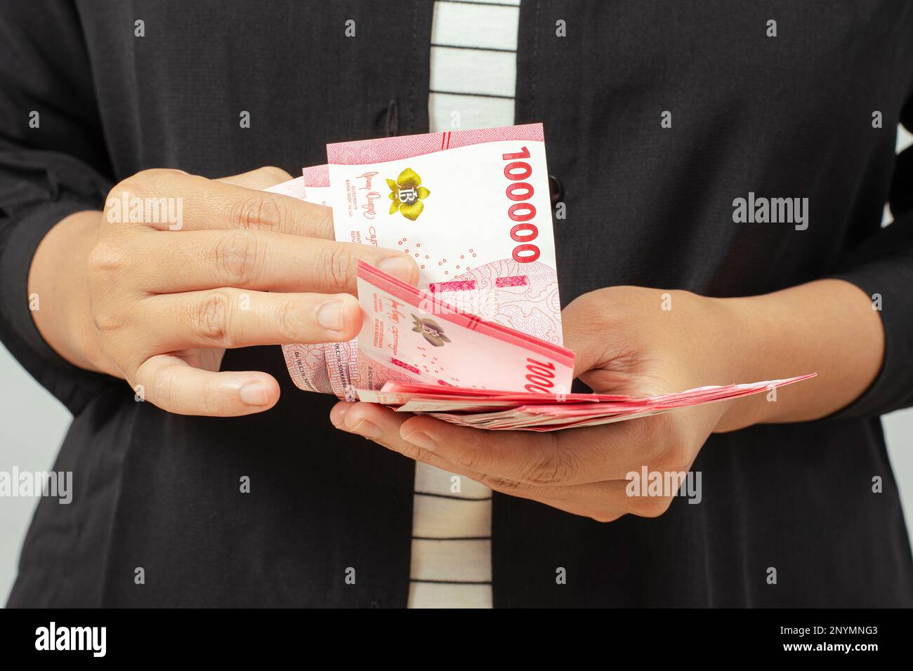 Cash payment concept. Indonesian rupiah currency (Rp. 100.000 Seratus ...