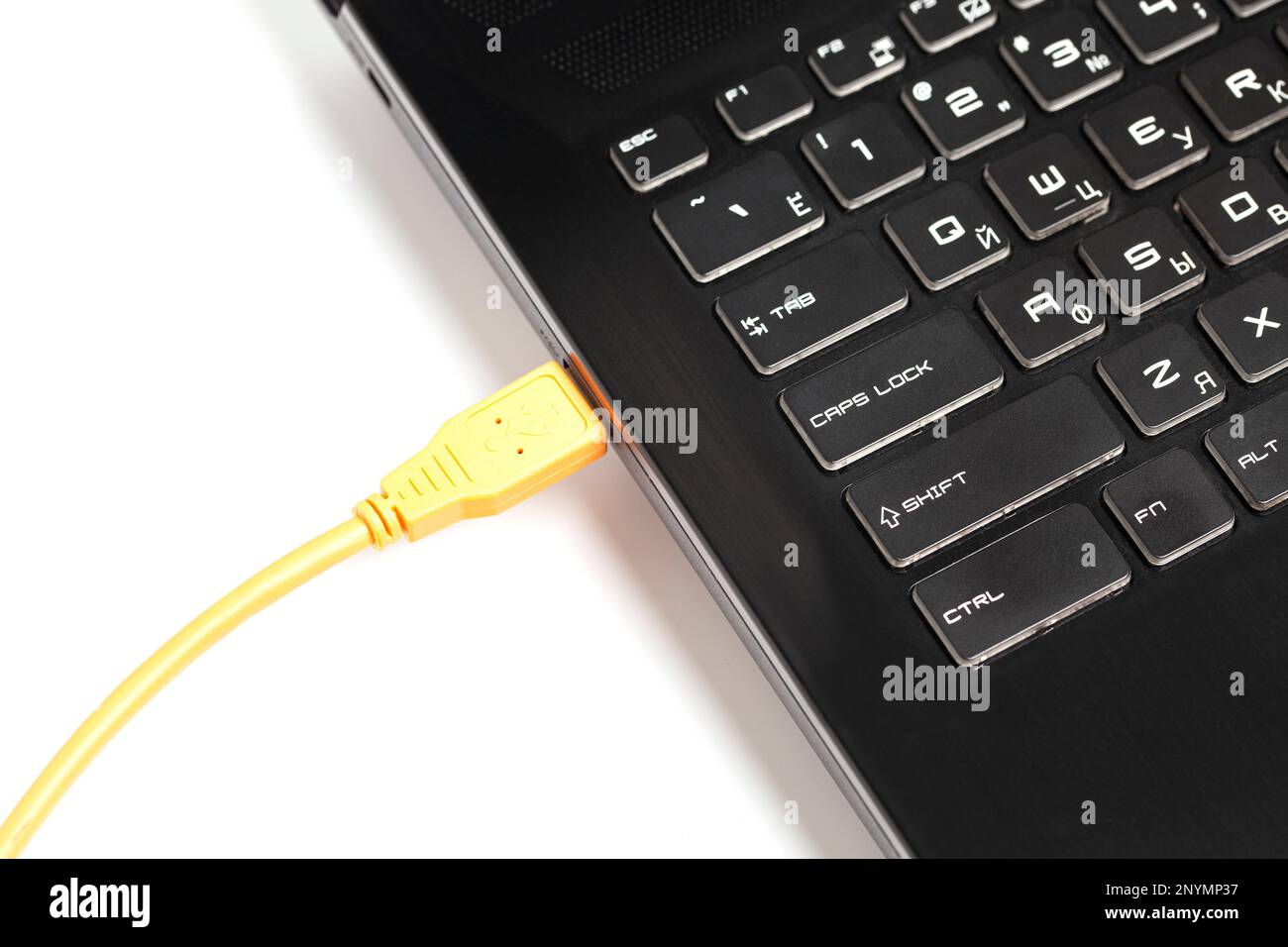 laptop with USB orange cable Stock Photo