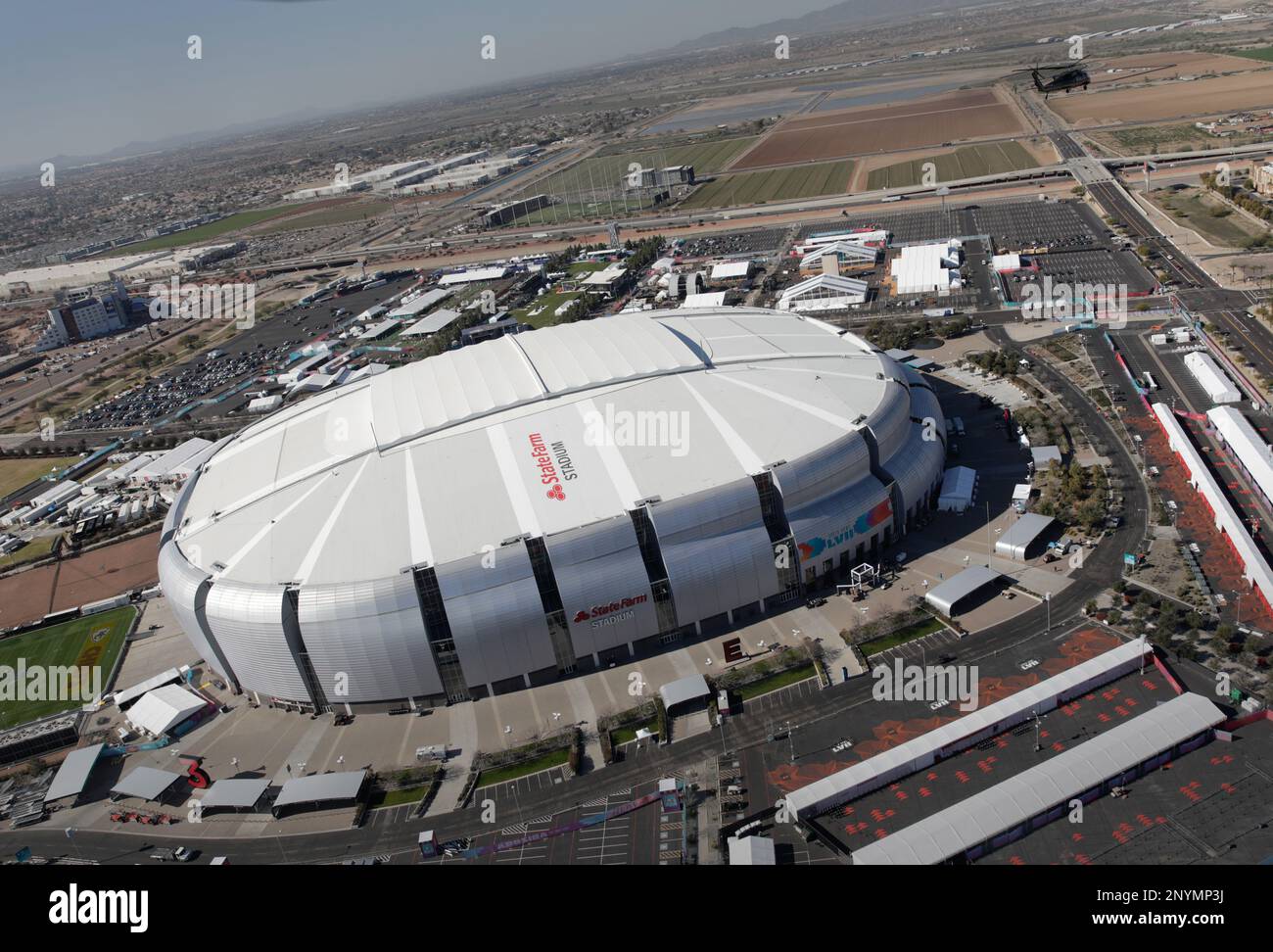 A U.S. Customs and Border Protection Air and Marine Operations UH-60 Black Hawk helicopter conducts a flyover of State Farm Stadium as CBP provides significant security in advance of Super Bowl LVII in Glendale, Ariz.,Feb. 6, 2023. CBP Photo by Glenn Fawcett Stock Photo